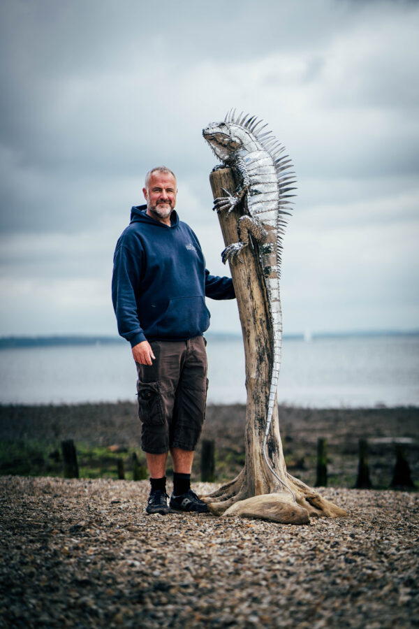 Iguana garden sculpture with artist and sculptor, Michael Turner