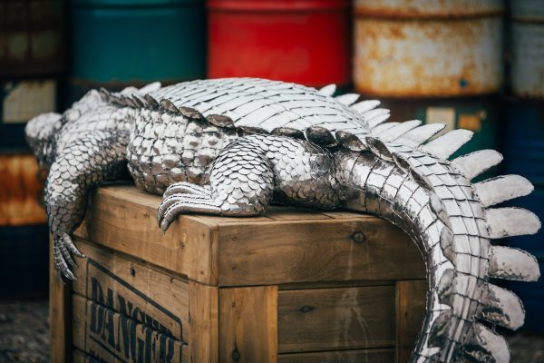 Crocodile on a crate garden sculpture