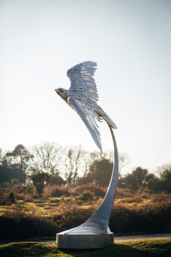 One-of-a-kind stainless steel peregrine falcon by Michael Turner. Handmade garden sculpture.