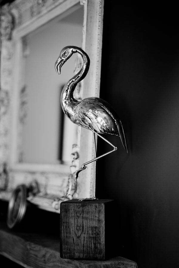 Stainless steel flamingo sculpture for a modern interior.