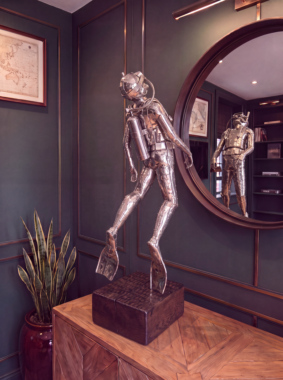 Scuba diving statue in full snorkle and mask with the tank on his back, swimming upwards with fins. A perfect unique gift for a diving enthusiast